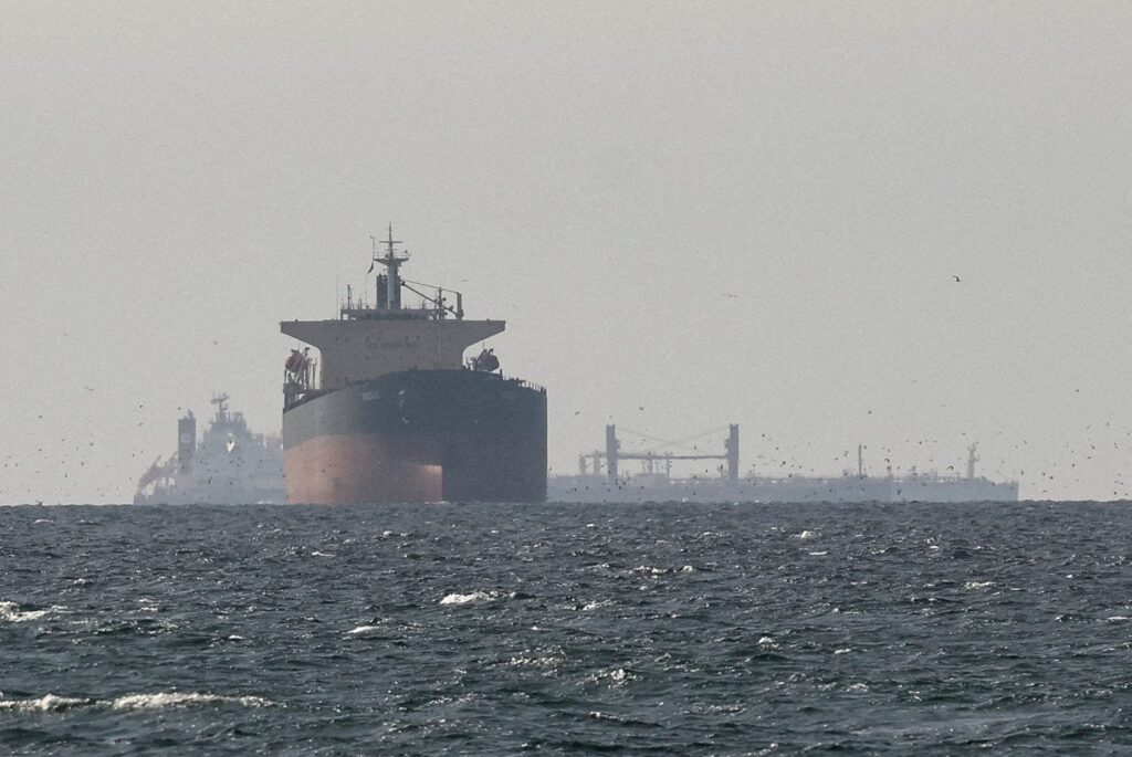 Controlled Passage: First Ships Edge Through Hormuz as Crisis Redefines Global Shipping