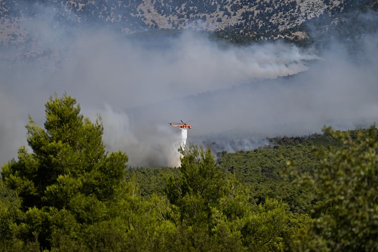 2 killed when firefighting helicopters collide near Athens as Europe’s wildfire emergency rages